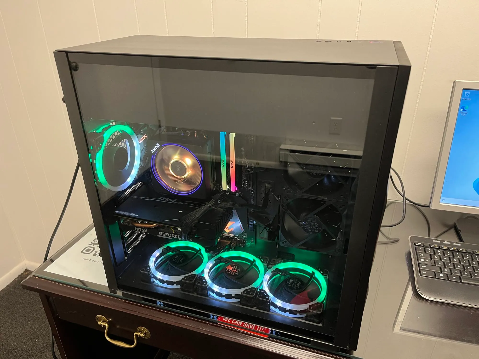 A custom AMD build with RGB fans on the shop workbench