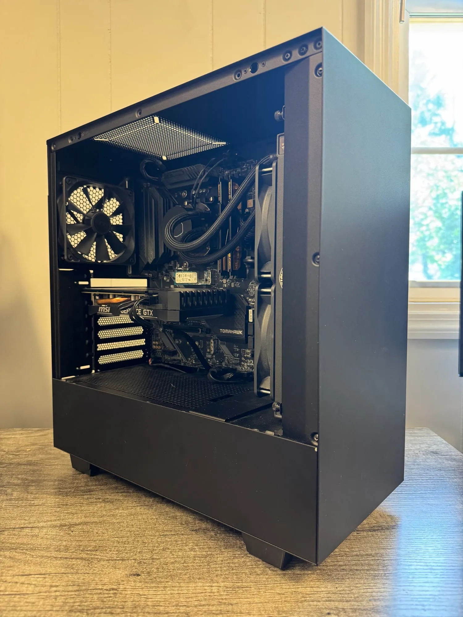An all-black NZXT gaming build with an AIO cooler