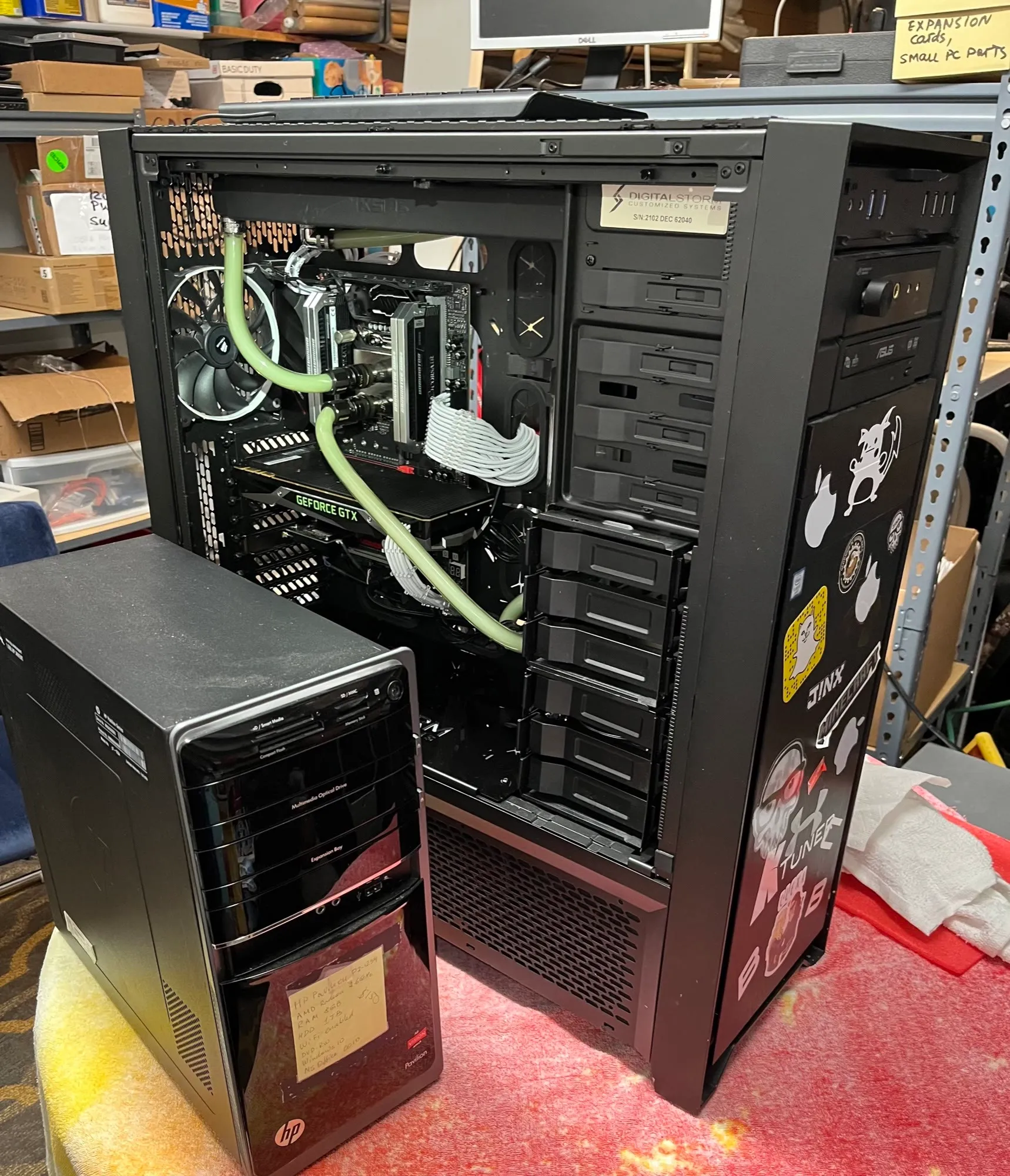 An open custom water-cooled PC on the bench for a coolant replacement
