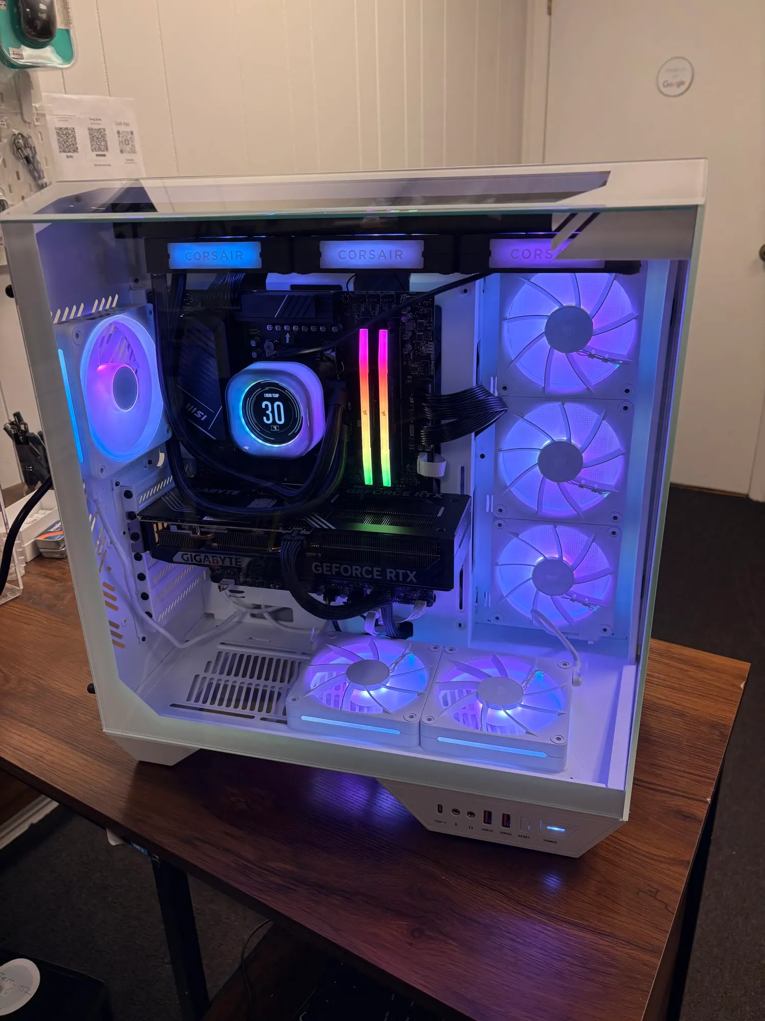A custom white-themed gaming PC with a Corsair AIO cooler and RTX graphics card, built at JY Computer Services
