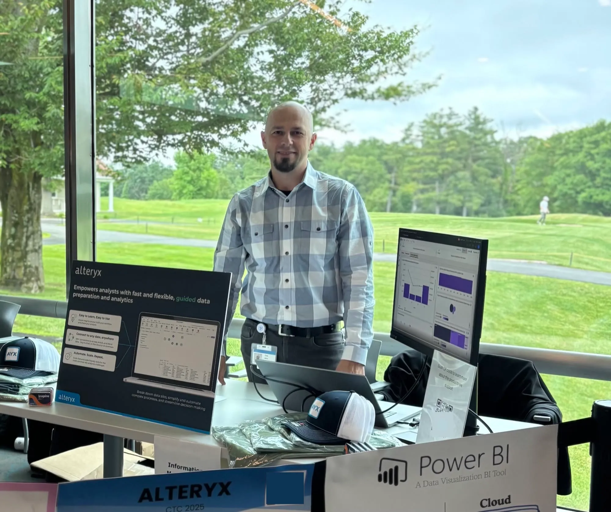 Yuriy of JY Computer Services presenting analytics dashboards at an industry event