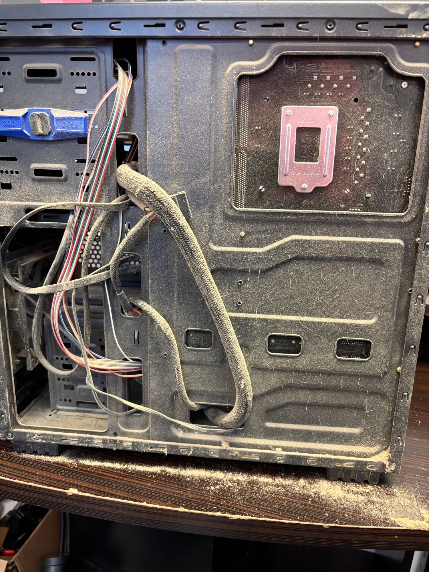 A dust-caked PC interior before a tune-up and cleaning